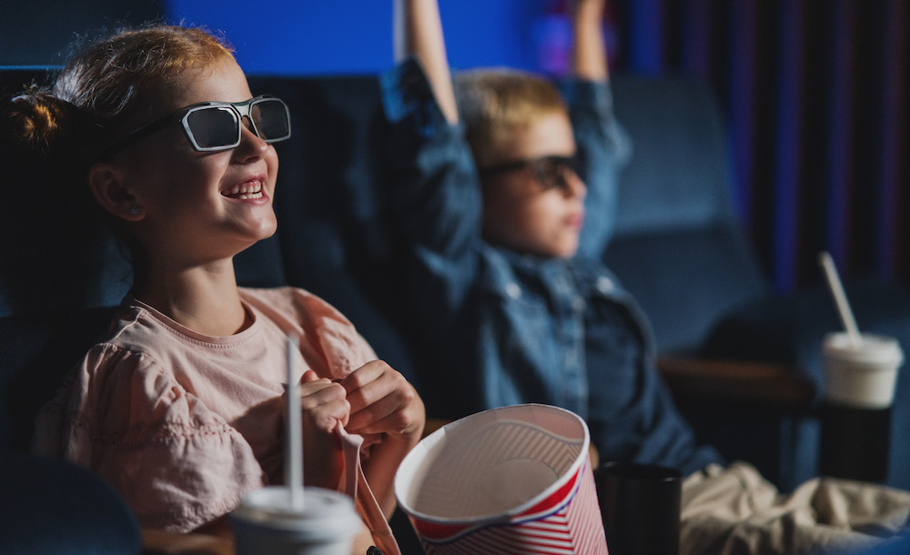 children eating popcorn at the best movie theater in kansas city